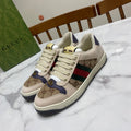 Gucci unisex sneakers, lace-up canvas, logo print panels and green-red stripe.