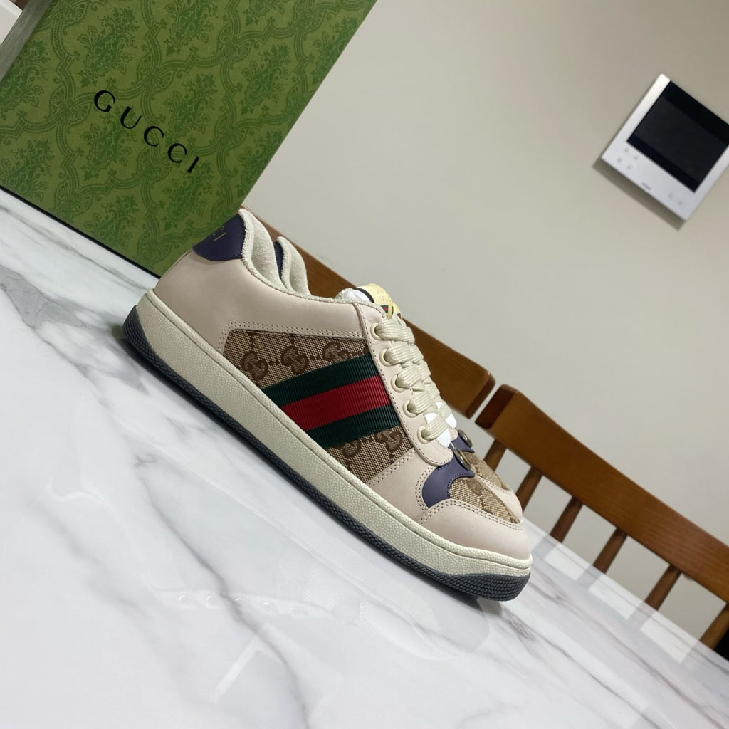 Gucci unisex sneakers, side view, beige upper with logo print and color stripe.