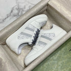 White Gucci unisex sneakers with gray stripe and perforated toe panel