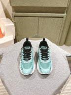 Mint and black lace-up sneakers with white sole and Dior logo on tongue