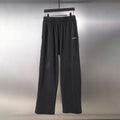 Black Balenciaga wide-leg pants with elastic waistband