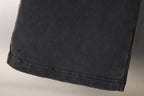 Black pants hem with stitched cuff edge