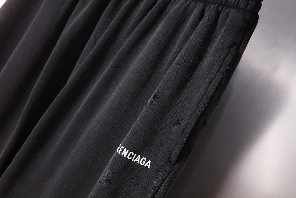 Black pants with embroidered BALENCIAGA word logo on side panel