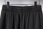 Black pants waistband with gathered elastic and inner drawstring ties