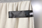 Balenciaga gray pants with black size label inside the waistband