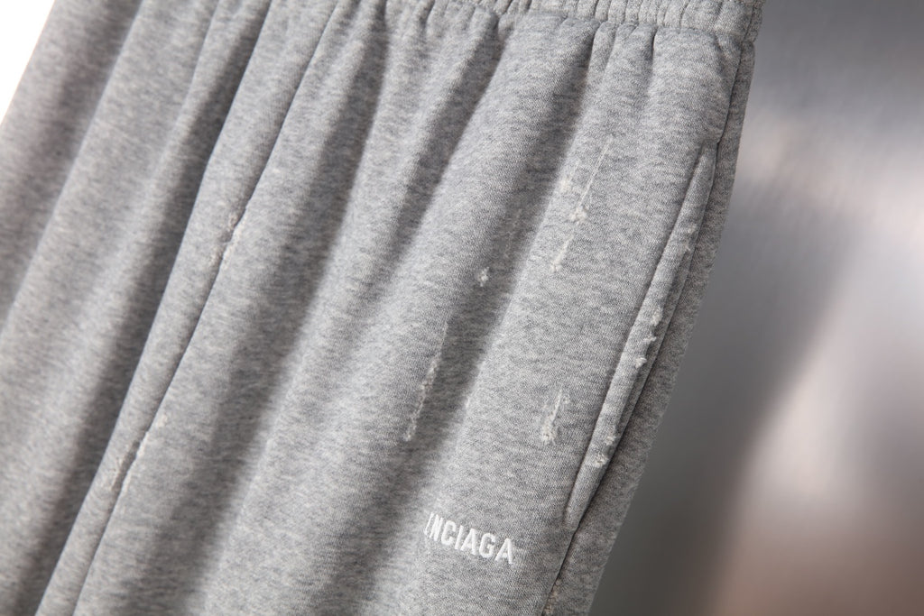 Balenciaga gray knit pants with gathered front pleats and logo detail