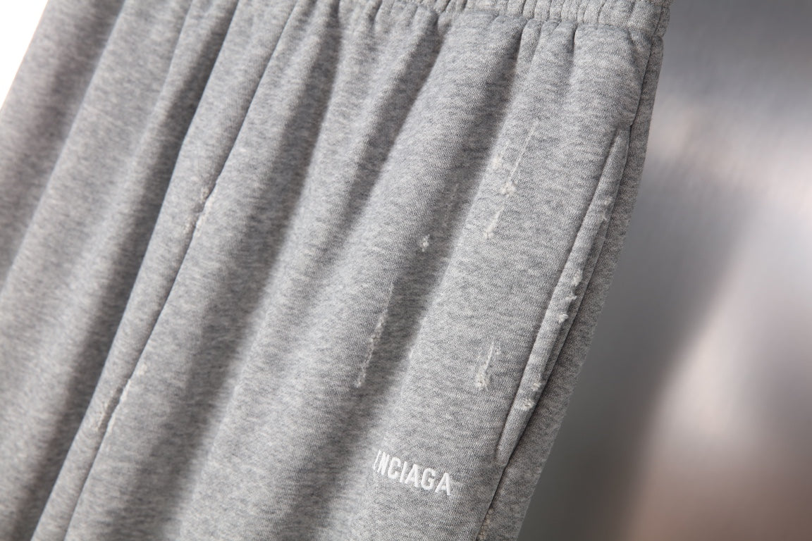 Balenciaga gray knit pants with gathered front pleats and logo detail