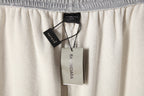 Balenciaga gray pants with elastic waistband and hanging product tags