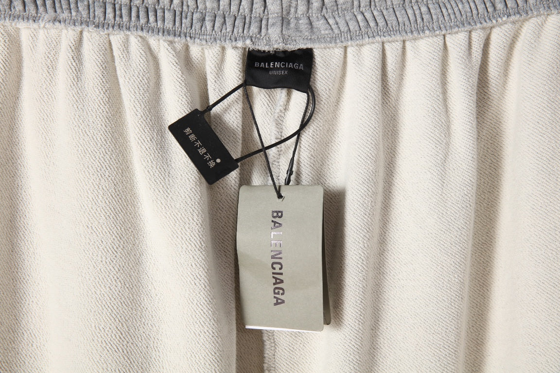 Balenciaga gray pants with elastic waistband and hanging product tags