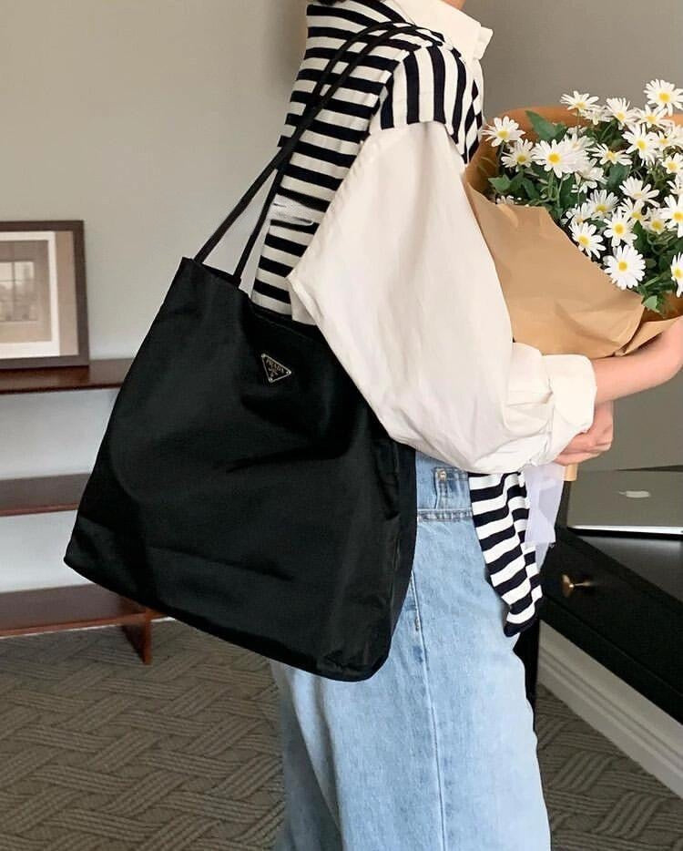Prada nylon tote bag in black, triangular logo and open-top handles