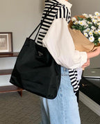 Prada nylon tote bag in black, triangular logo and open-top handles