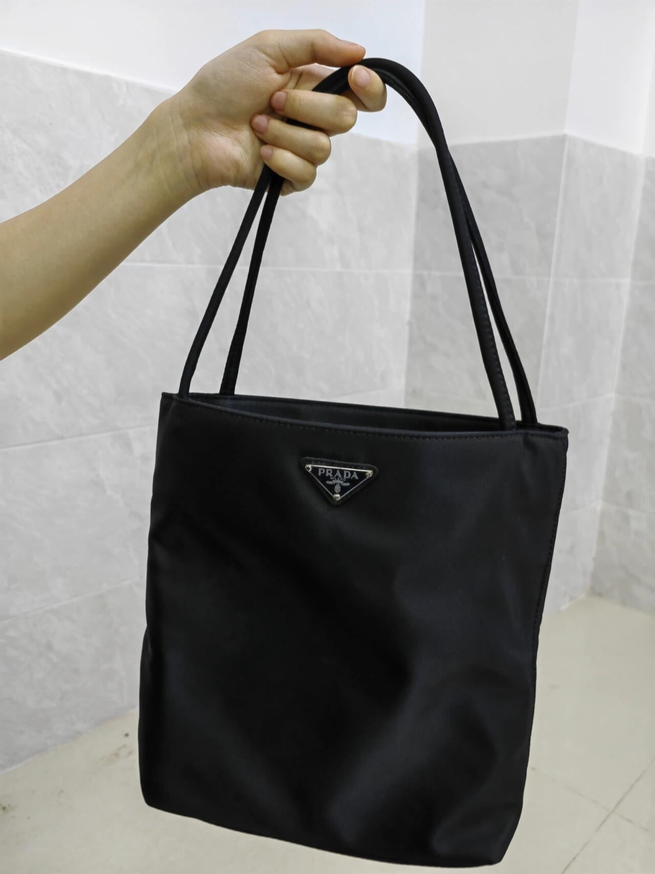 Prada nylon tote bag in black, triangular logo and top handles