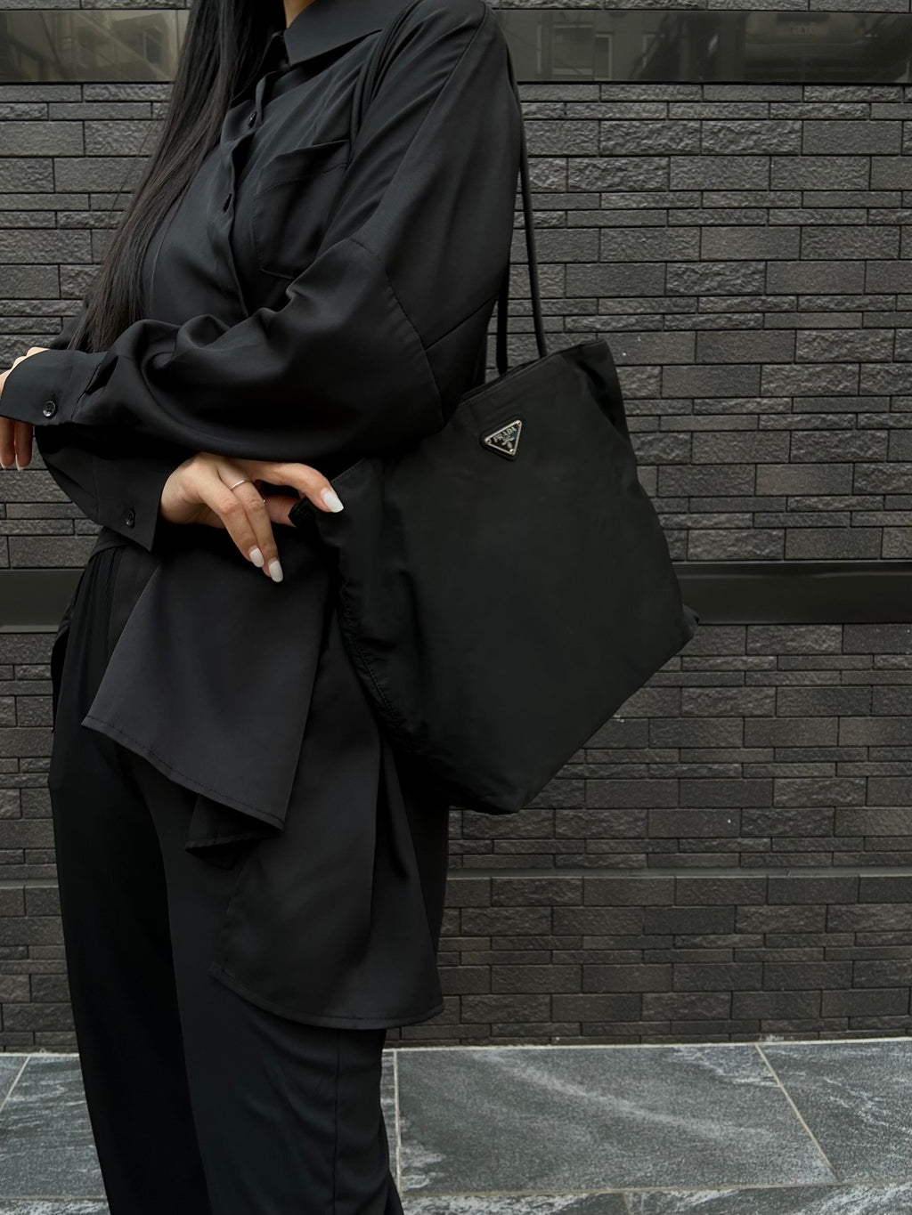 Prada nylon tote bag in black with triangular logo on the front