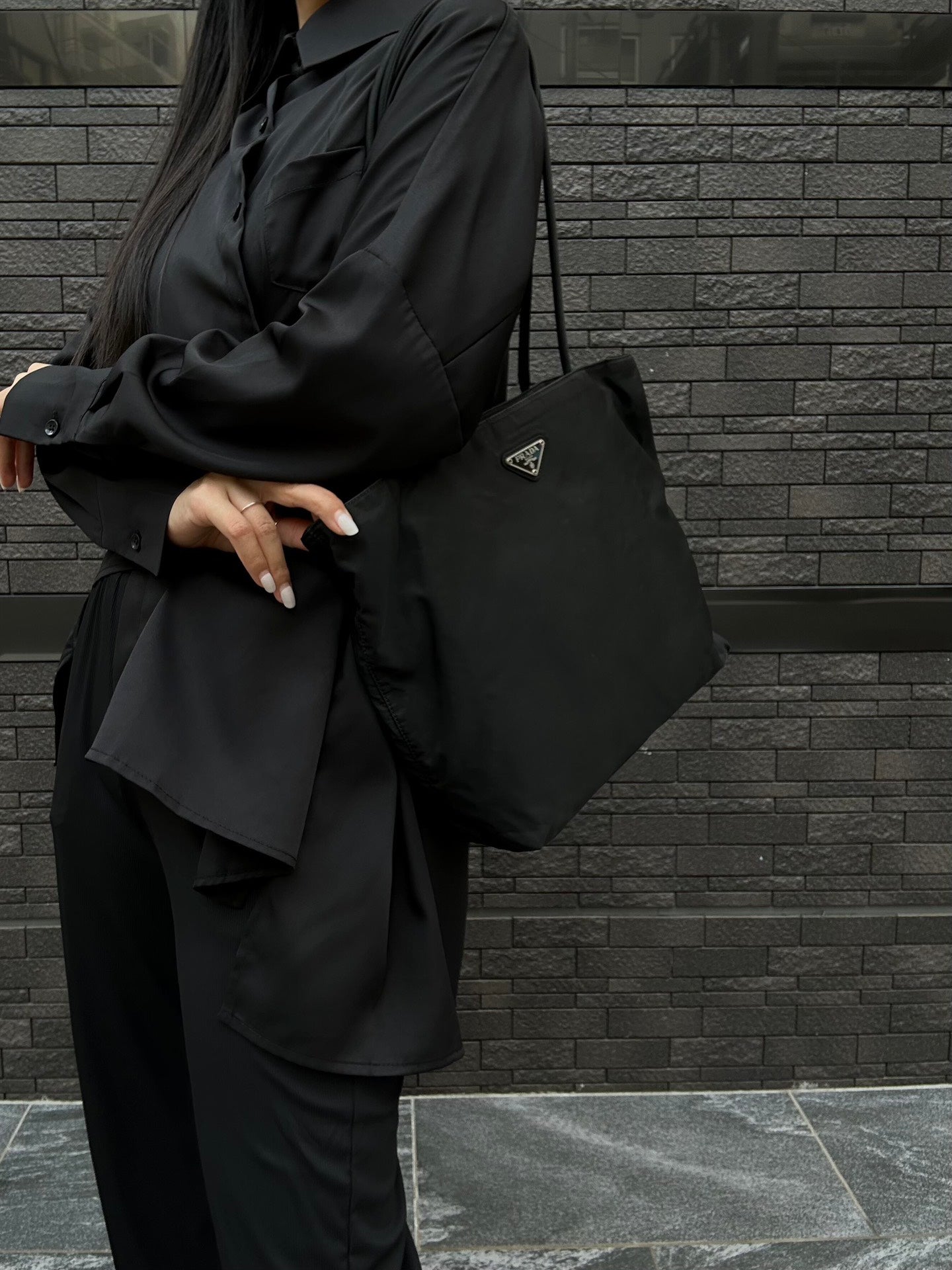 Prada nylon tote bag in black with triangular logo on the front