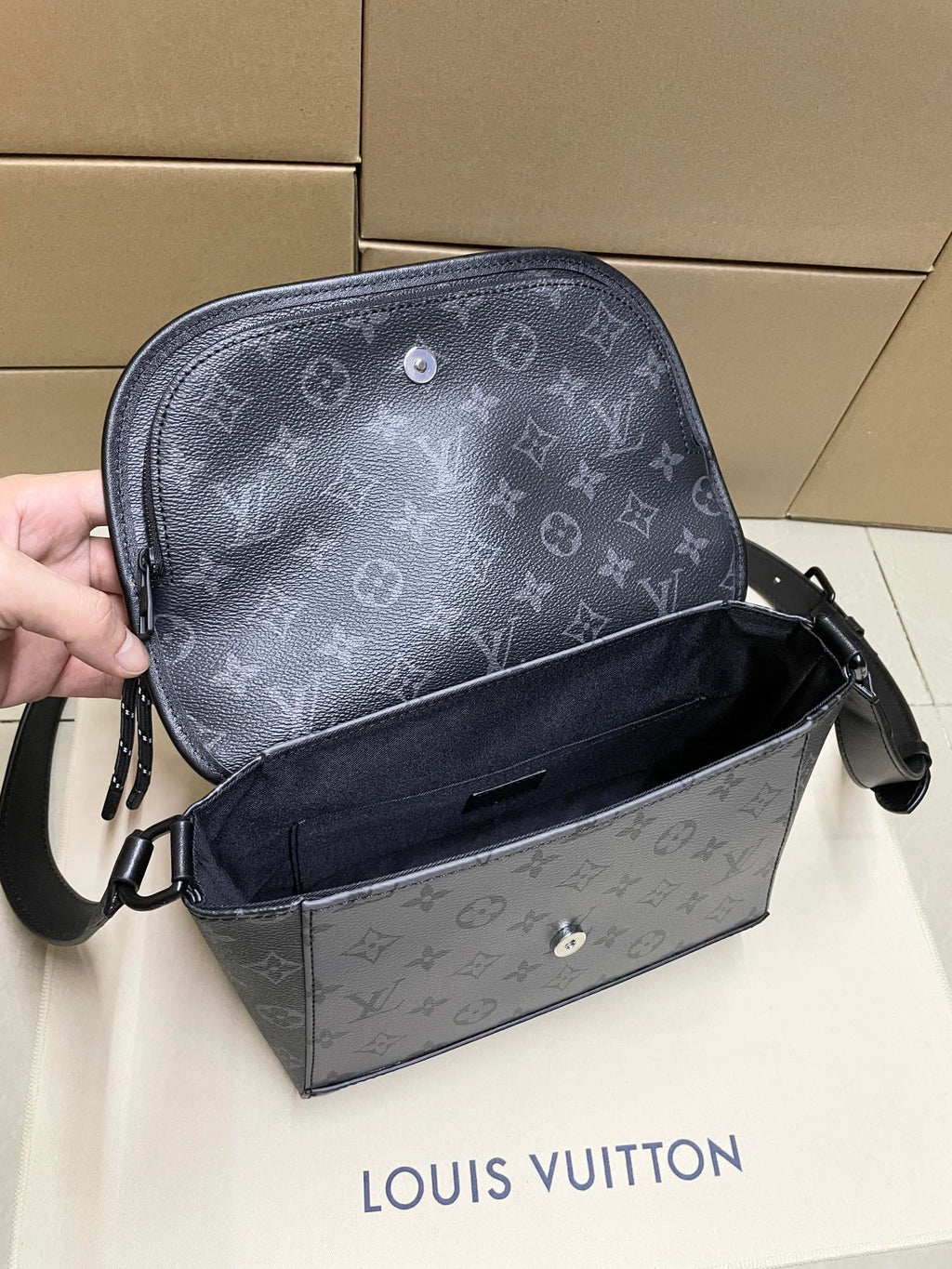 Louis Vuitton men's crossbody bag in gray monogram canvas, side open