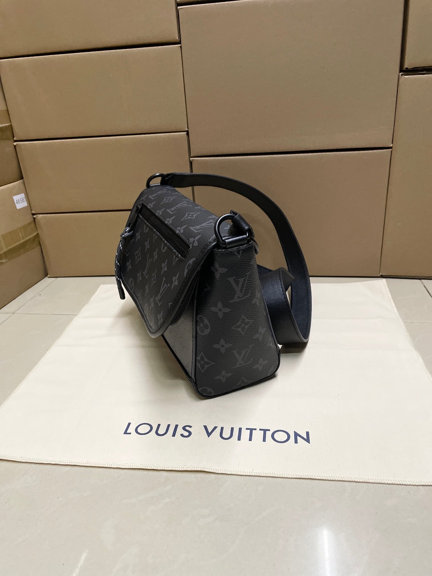 Louis Vuitton monogram crossbody bag, dark blue-gray, side view, shoulder strap