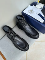Black leather lace-up ankle boots with thick rubber sole