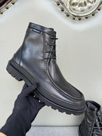 Black leather lace-up boot, lace detail and sidewall sole visible