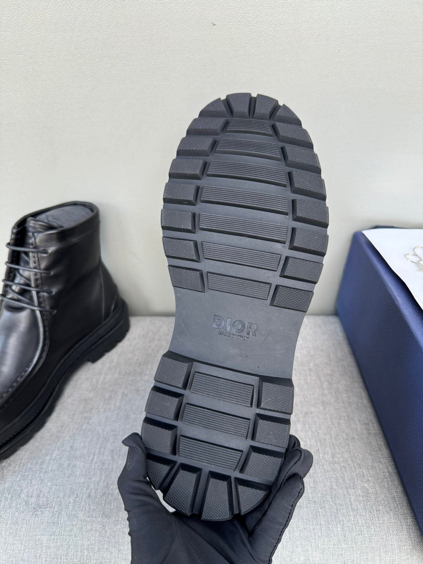 Black leather lace-up boot outsole and heel tread, bottom view