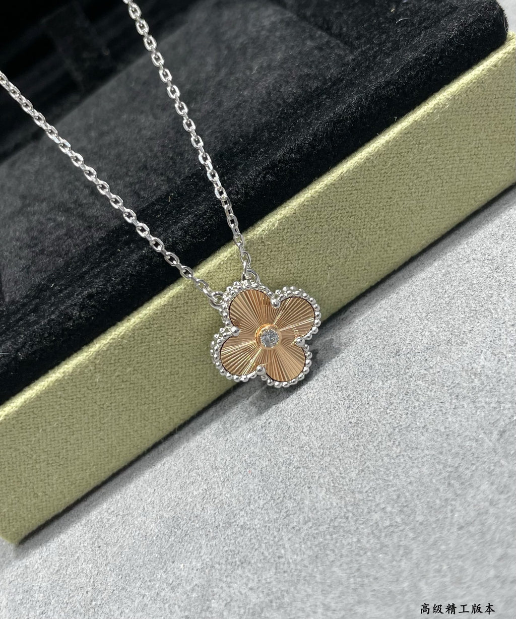 Silver-tone flower pendant necklace with crystal border and link chain