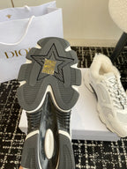 Dior unisex sneaker outsole with deep tread pattern and star emblem.