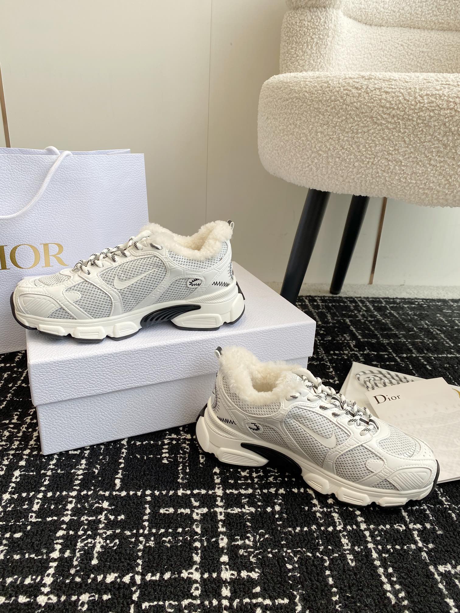 Dior unisex sneakers in white mesh with lace-up front and plush inner lining.