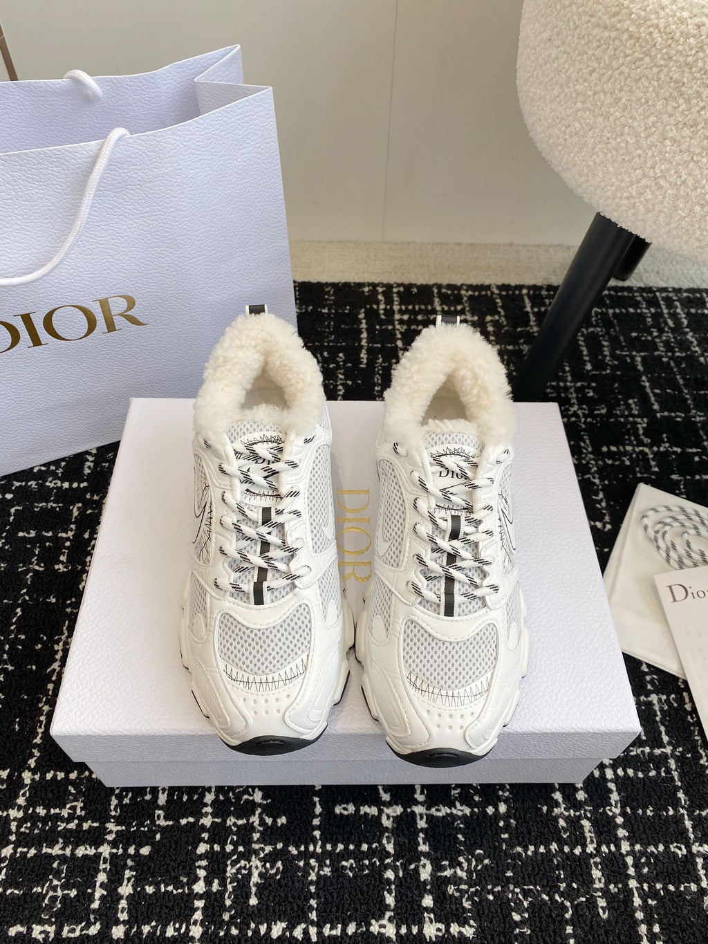 Dior unisex sneakers in white with lace-up design and plush shearling lining.