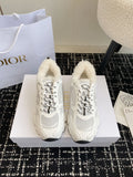 Dior unisex sneakers in white with lace-up design and plush shearling lining.