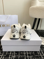 Dior unisex sneakers in white with star-shaped heel detail and Dior heel tabs.