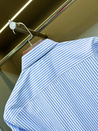 Light blue striped Burberry button-up shirt shoulder and yoke detail