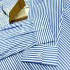 Light blue striped Burberry button-up shirt cuffs with round buttons