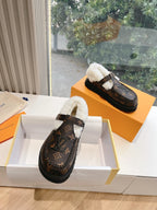 Louis Vuitton monogram slippers with white shearling lining and side buckle detail