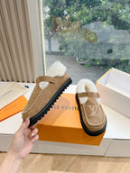 Louis Vuitton tan suede shearling mules with buckled strap and LV side logo