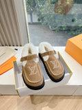 Louis Vuitton tan suede shearling mules with buckled strap and LV logo