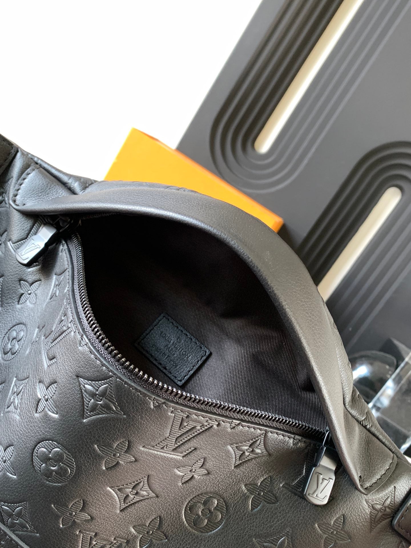 Louis Vuitton monogram crossbody bag open interior with zip pocket and dark lining