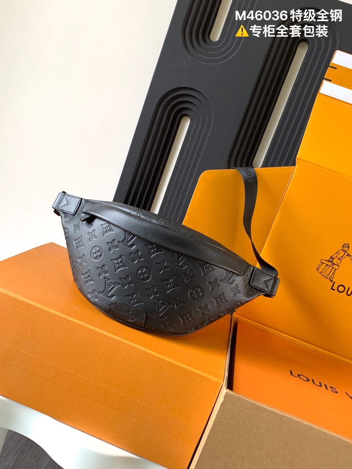 Louis Vuitton monogram crossbody bag in dark charcoal with top zipper and adjustable strap