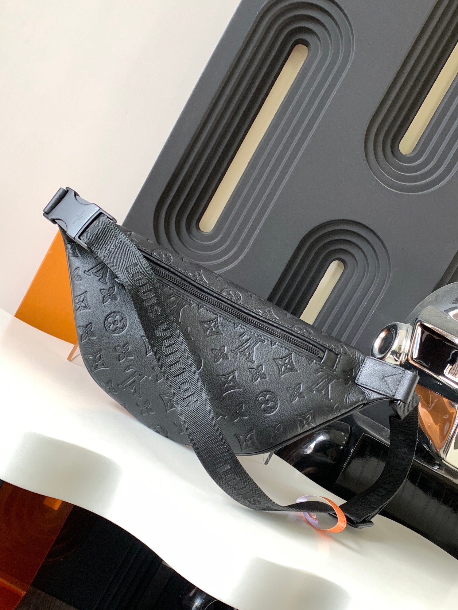 Louis Vuitton monogram crossbody bag with silver-tone buckle and front strap detail
