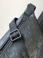 Louis Vuitton monogram crossbody bag close-up of strap buckle and embossed pattern