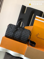 Dark monogram leather tote bag with top handles and adjustable crossbody strap