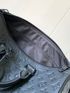Dark monogram zip pocket interior with fabric lining and zipper track detail