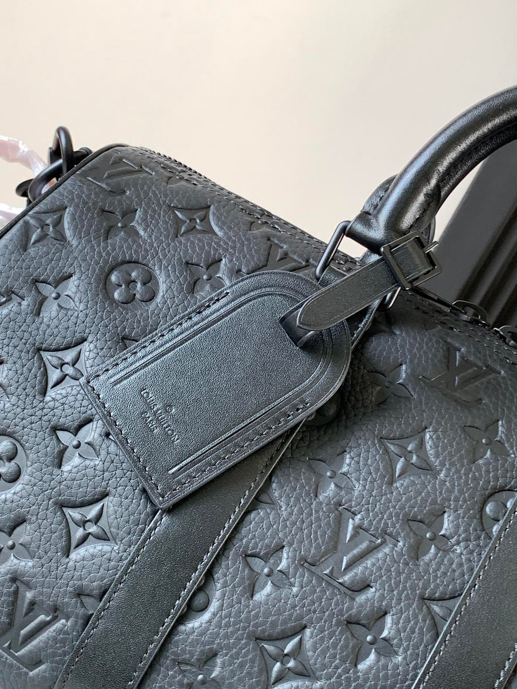 Dark monogram handbag with card holder patch and double top handles