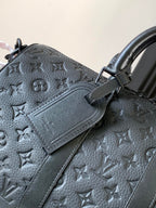 Dark monogram handbag with card holder patch and double top handles