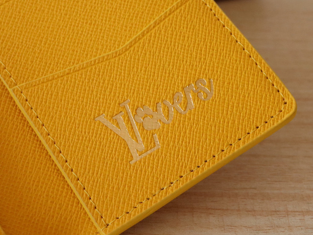 Yellow Louis Vuitton monogram small wallet/card holder exterior logo close-up