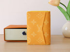 Yellow Louis Vuitton monogram small wallet/card holder folded side view