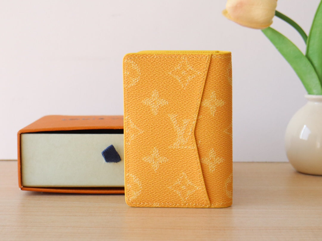 Yellow Louis Vuitton monogram small wallet/card holder folded side view
