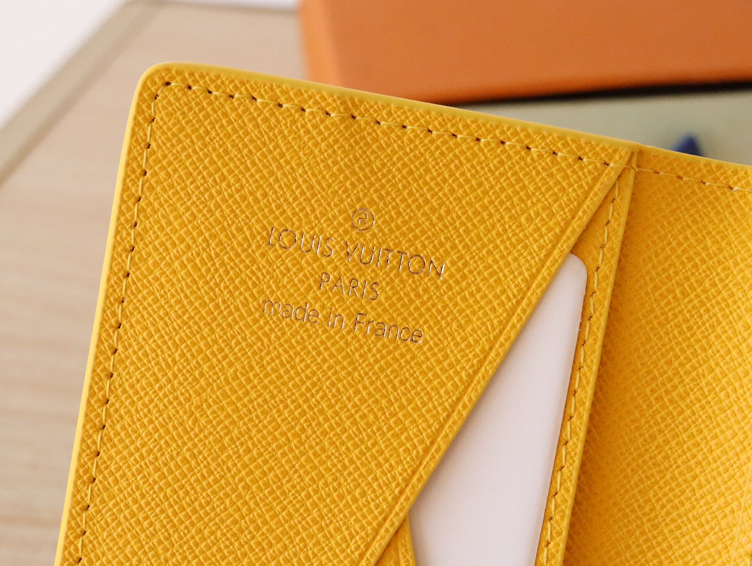 Yellow Louis Vuitton monogram small wallet/card holder inner panel close-up