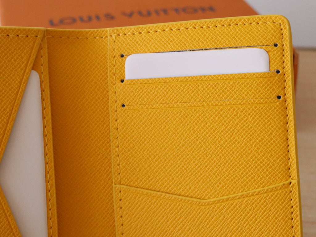 Yellow Louis Vuitton monogram small wallet/card holder with side pocket and stitching