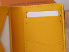 Yellow Louis Vuitton monogram small wallet/card holder with side pocket and stitching