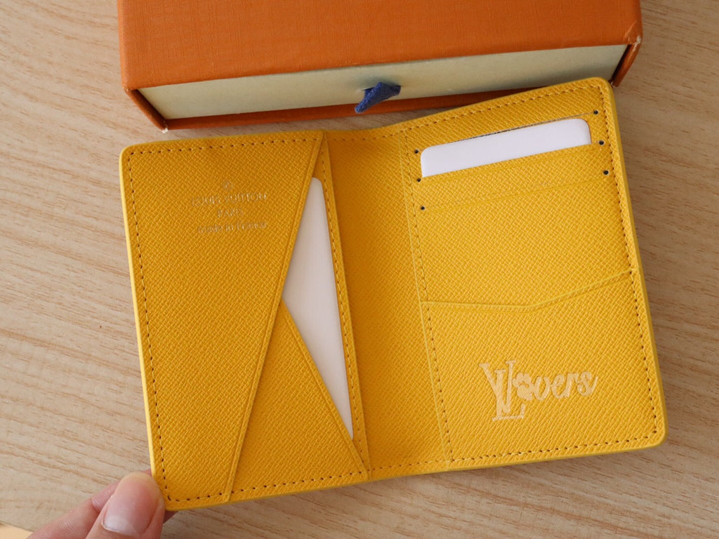 Yellow Louis Vuitton monogram small wallet/card holder with card slots visible