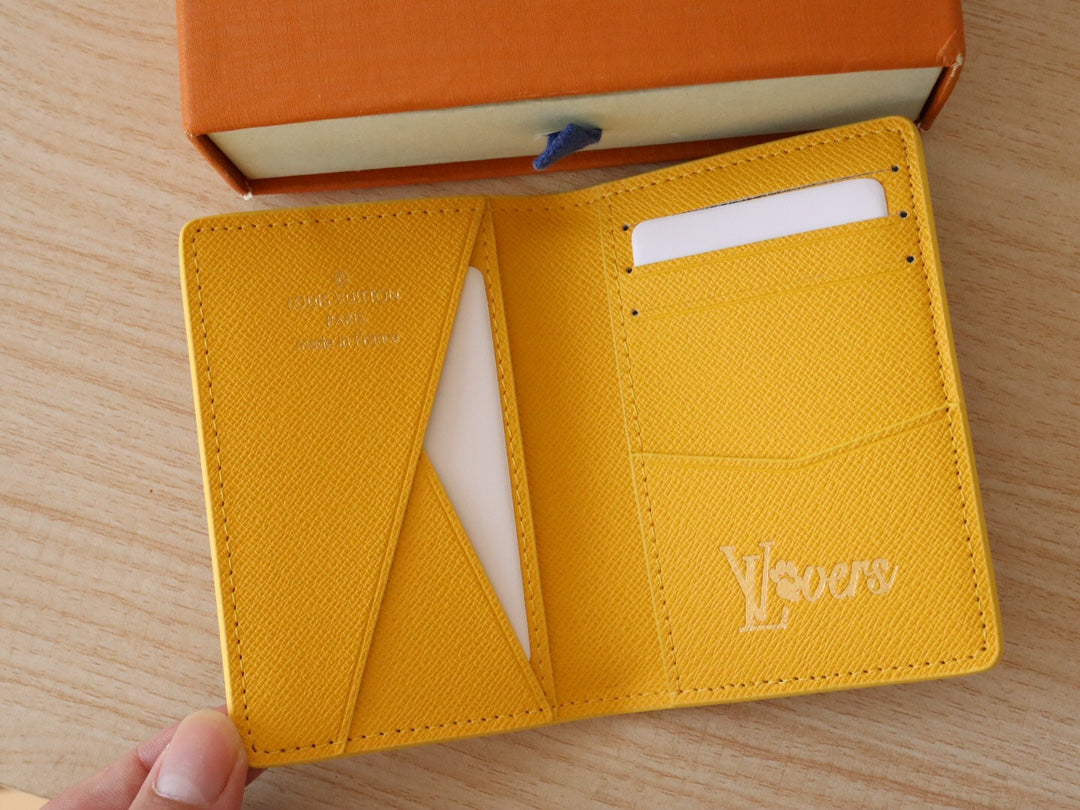 Yellow Louis Vuitton monogram small wallet/card holder with card slots visible